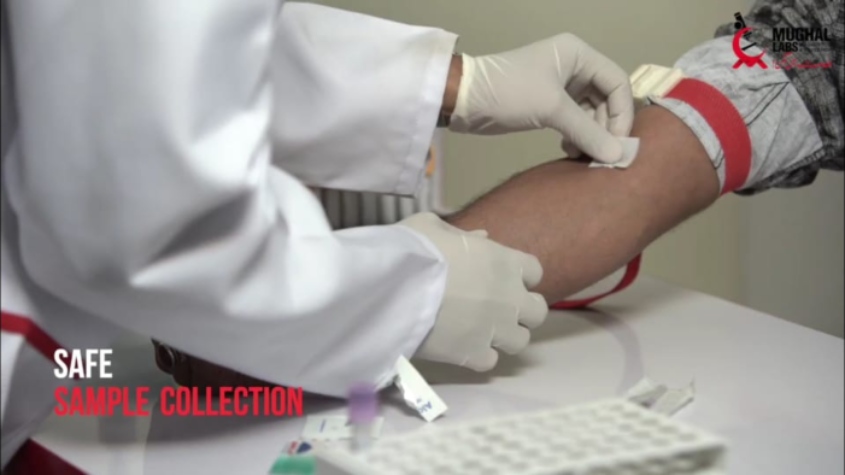 Doctor taking patient's blood sample