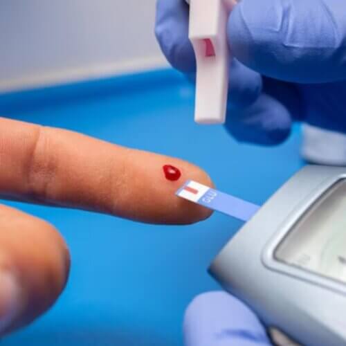 a person is getting a blood glucose test