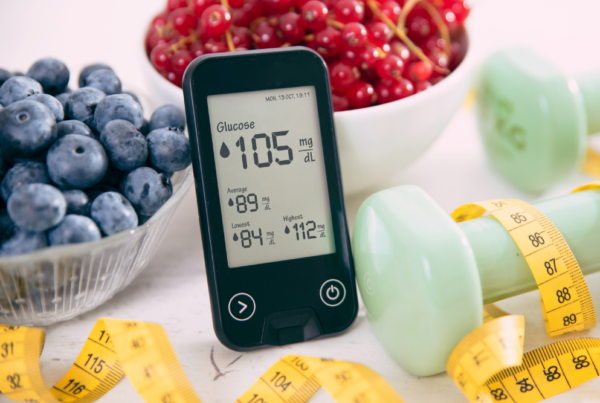 Digital glucose monitor showing blood sugar levels, ideal for those checking HbA1c test price in Lahore and seeking lab tests in Lahore.