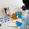 Medical lab professional conducting blood tests and clinical analysis at Mughal Labs diagnostic center in Lahore.